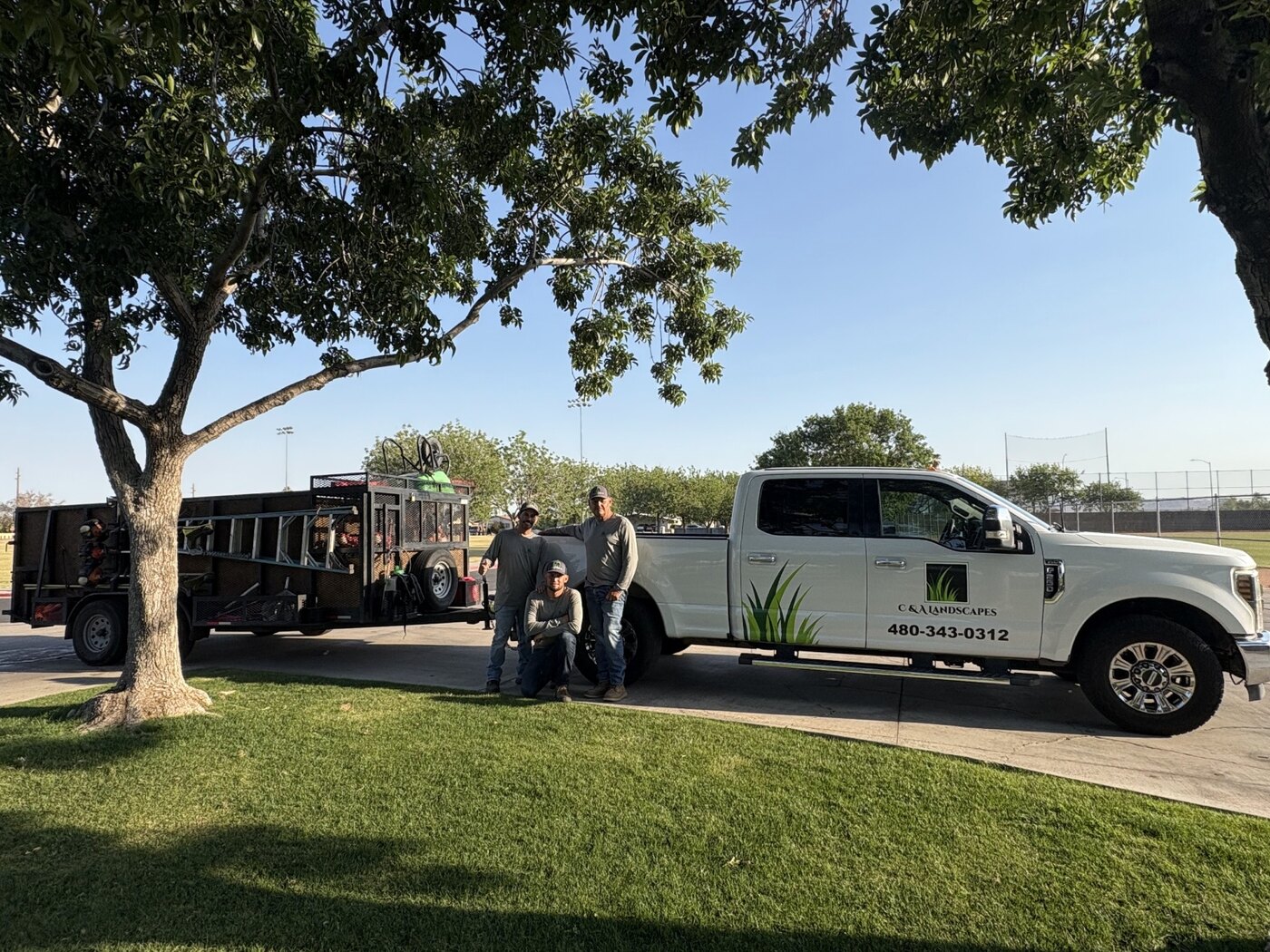 The C & A Landscapes crew with their truck and equipment